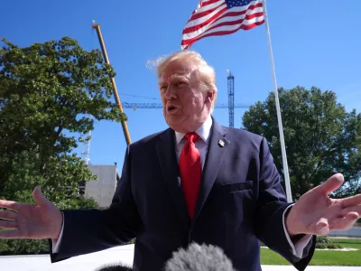President Donald Trump speaks with reporters before boarding Marine One on the South Lawn of the White House, Thursday Oct. 1, 2026, in Washington. (AP Photo/Jacquelyn Martin)