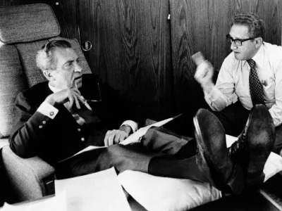 FILE - In this June 25, 1974, photo released by the White House, President Richard Nixon listens to his Secretary of State Dr. Henry Kissinger aboard the plane that brought the U.S. president to Belgium. Within two months Nixon had resigned, and in June 1975, the feisty ex-President defended his shredded legacy and shady Watergate-era actions in grand jury testimony that he thought would never come out. On Thursday, Nov. 10, 2011, it did. (AP Photo/White House Photo, Ollie Akins)