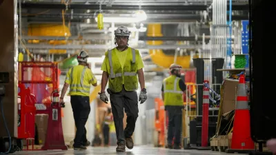 FILE PHOTO: People work inside the Microsoft data center campus' Graphical Processing Unit, currently under construction, after Microsoft's Vice Chair and President Brad Smith announced a plan to spend  billion on an additional artificial intelligence data center, in Mount Pleasant, Wisconsin, U.S., September 18, 2025. REUTERS/Audrey Richardson/File Photo/File Photo
