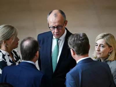 FILE PHOTO: German Chancellor Friedrich Merz speaks to Interior Minister Alexander Dobrindt, Minister for Special Tasks and Head of the Federal Chancellery Nina Warken, Health Minister Carsten Linnemann and German Parliament President Julia Kloeckner, during a plenary session of the lower house of parliament, the Bundestag, in Berlin, Germany September 25, 2026. REUTERS/Annegret Hilse/File Photo