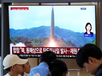 A TV screen shows a file image of a North Korean missile launch during a news program at Seoul Railway Station in Seoul, South Korea, Saturday, Oct. 3, 2026. (AP Photo/Ahn Young-joon)