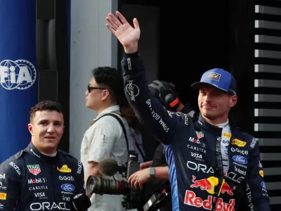 Formula One F1 - Bahrain Grand Prix - Sepang International Circuit, Sepang, Malaysia - October 3, 2026 Red Bull's Max Verstappen celebrates after qualifying in pole position with third placed Red Bull's Isack Hadjar REUTERS/Annice Lyn/Pool   TPX IMAGES OF THE DAY