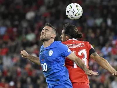 Soccer Football - Nations League - Group B1 - Switzerland v Slovenia - Thermoplan Arena, Lucerne, Switzerland - October 3, 2026 Slovenia's Aljosa Matko in action with Switzerland's Ricardo Rodriguez REUTERS/Romina Amato