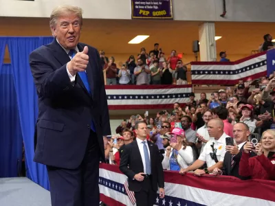 President Donald Trump arrives to speak during an event at Butler High School in Vandalia, Ohio, Saturday, Oct. 3, 2026. (AP Photo/Mark Schiefelbein)