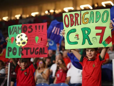 Portugal young fans hold up posters on the stands before the Nations League soccer match between Portugal and Norway in Porto, Portugal, Sunday, Oct. 4, 2026. (AP Photo/Luis Vieira)