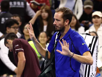 Tennis - China Open - National Tennis Center, Beijing, China - October 5, 2026 Russia's Daniil Medvedev walks off the court after being disqualified from his semi final match against Serbia's Novak Djokovic for hitting a ball into the crowd injuring a spectator REUTERS/Tingshu Wang