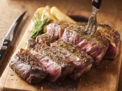 A domestic Wagyu steak simply grilled with salt and pepper, cooked to a perfect medium-rare with a savory sear and a juicy red center.