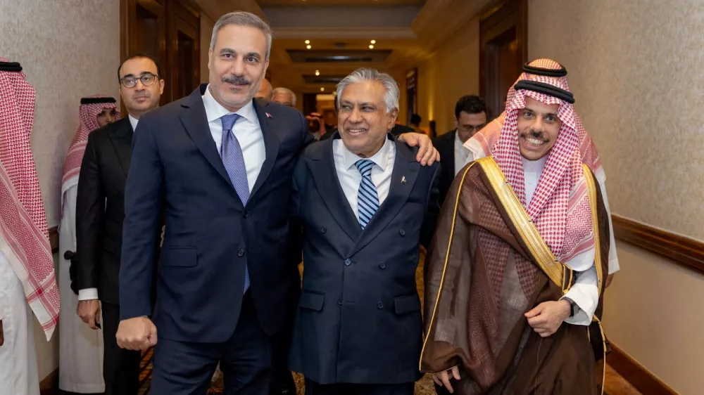 Turkey's Foreign Minister Hakan Fidan, Pakistan's Deputy Prime Minister and Foreign Minister Mohammad Ishaq Dar and Saudi Arabia's Foreign Minister Prince Faisal bin Farhan Al Saud leave after a committee meeting of Mecca defence pact in Riyadh, Saudi Arabia, October 5, 2026. Turkish Foreign Ministry/Handout via REUTERS ATTENTION EDITORS - THIS PICTURE WAS PROVIDED BY A THIRD PARTY. NO RESALES. NO ARCHIVES.    TPX IMAGES OF THE DAY