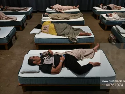 Attendees take part in a sleep competition organized by a mattress brand in Tokyo on October 5, 2026.,Fotografija: 1140761974, Licenca: Rights-managed, Omejitve:, Izdaja modela: no 
