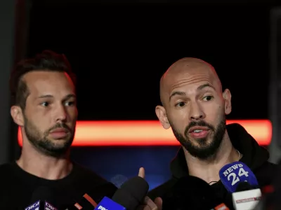 FILE PHOTO: Tristan and Andrew Tate deliver a press statement in front of their house after landing back in Romania, near Bucharest, Romania, March 22, 2025. Inquam Photos/Eduard Vinatoru via REUTERS ATTENTION EDITORS - THIS IMAGE WAS PROVIDED BY A THIRD PARTY. ROMANIA OUT. NO COMMERCIAL OR EDITORIAL SALES IN ROMANIA/File Photo