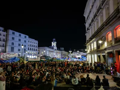 People gather at the protest camp at Puerta del Sol square following the death of Maricarmen Abascal, the 87-year-old woman whose eviction sparked housing protests in Spain, in Madrid, Spain, October 7, 2026. REUTERS/Violeta Santos Moura