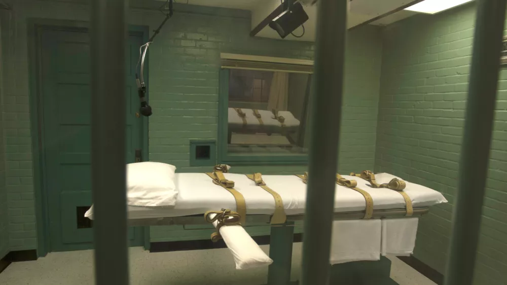 The death chamber is seen through the steel bars from the viewing room at the federal penitentiary in Huntsville, Texas in this September 29, 2010 handout. Texas is set to execute on March 19, 2014, Ray Jasper, an aspiring rap musician who was convicted of slitting the throat and stabbing to death a music studio owner in San Antonio so that he could rob him of equipment. The state, which executes more people than any other in the United States, plans to execute Jasper, 33, at 6 p.m. CDT (2300 GMT) by lethal injection at its death chamber in Huntsville. Picture taken September 29, 2010. REUTERS/Jenevieve Robbins/Texas Dept of Criminal Justice/Handout via Reuters (UNITED STATES - Tags: CRIME LAW ENTERTAINMENT) ATTENTION EDITORS - FOR EDITORIAL USE ONLY. NOT FOR SALE FOR MARKETING OR ADVERTISING CAMPAIGNS. THIS IMAGE HAS BEEN SUPPLIED BY A THIRD PARTY. IT IS DISTRIBUTED, EXACTLY AS RECEIVED BY REUTERS, AS A SERVICE TO CLIENTS - RTR3HRGI
