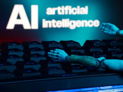 FILE PHOTO: A message reading "AI artificial intelligence", a keyboard, and robot hands are seen in this illustration taken January 27, 2025. REUTERS/Dado Ruvic/Illustration/File Photo
