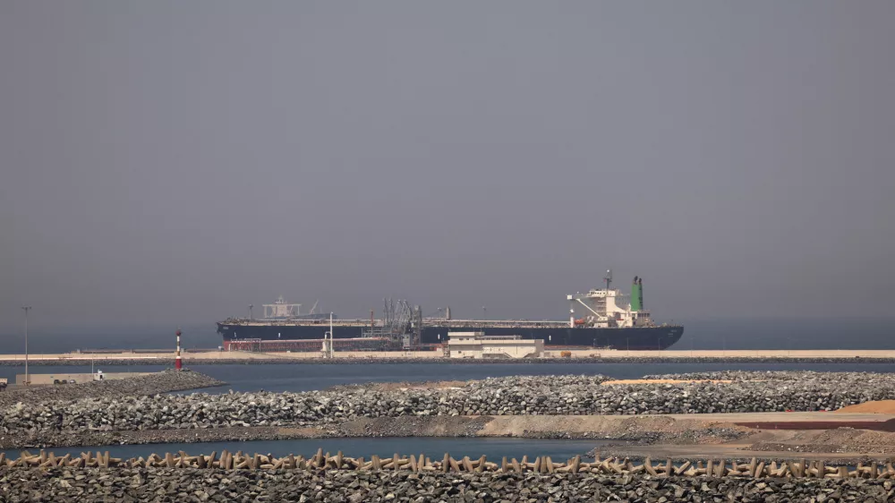 FILE PHOTO: A cargo ship docked at the Port of Fujairah, as the U.S.-Israel conflict with Iran limits marine traffic in the Strait of Hormuz, in Fujairah, United Arab Emirates, May 6, 2026. REUTERS/Amr Alfiky/File Photo