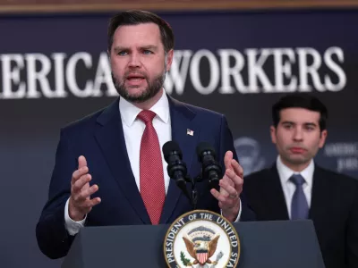 Vice President JD Vance speaks as Labor Secretary Keith Sonderling listens during a news conference on the Fraud Task Force inside the Eisenhower Executive Office Building on the White House campus, Thursday, Oct. 8, 2026, in Washington. (AP Photo/Tom Brenner)