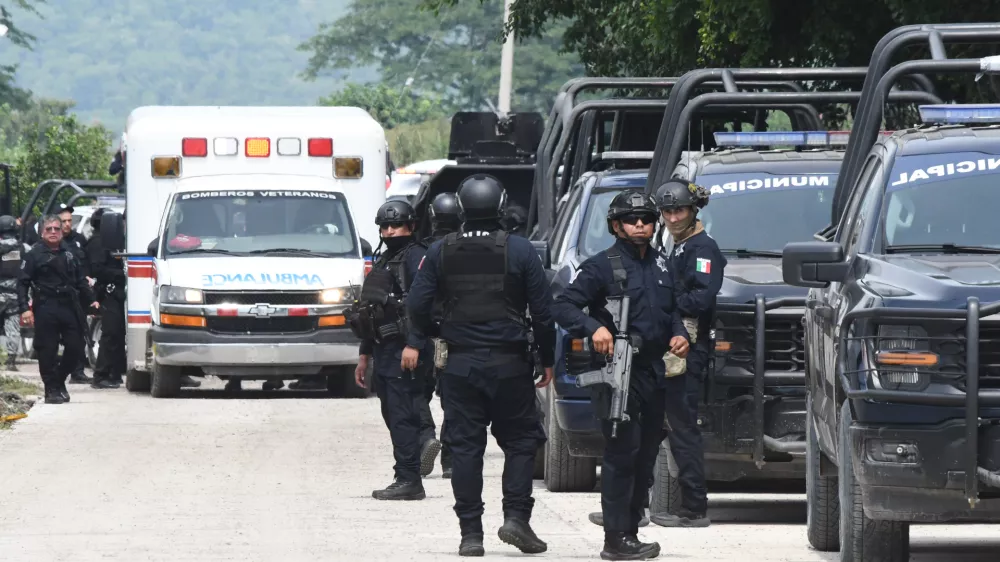 Police officers gather in front of the El Castillo Penitentiary during a riot in Mazatlan, Mexico, Thursday, Oct. 8, 2026. (AP Photo/Fausto Camacho)