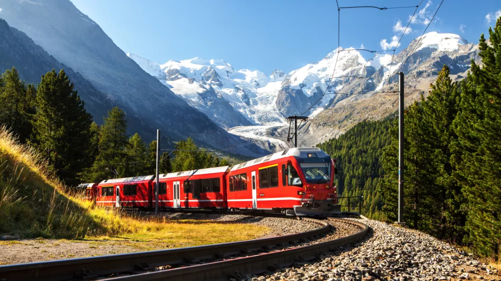 colourful summer daytime images small train in large landscape