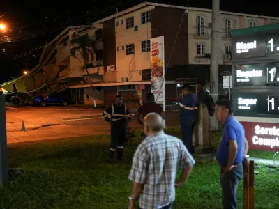 People stand near cars damaged by falling debris after an earthquake struck near the southern coast of Panama, in Penonome, Panama, October 9, 2026. REUTERS/Enea Lebrun