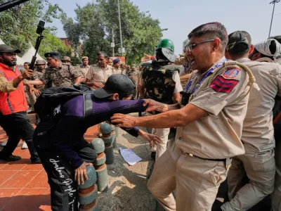 Police detain protesters during a demonstration demanding the resignation of Chief Election Commissioner Gyanesh Kumar in New Delhi, India, Saturday, Oct. 10, 2026.(AP Photo/Manish Swarup)