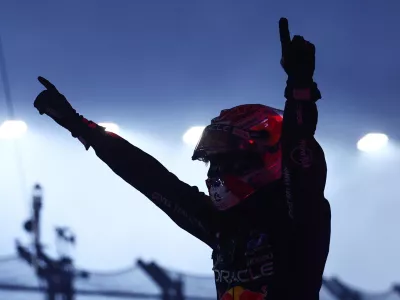 Formula One F1 - Singapore Grand Prix - Marina Bay Street Circuit, Singapore - October 11, 2026 Red Bull's Max Verstappen celebrates after winning the Singapore Grand Prix REUTERS/Jakub Porzycki