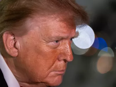 President Donald Trump speaks with reporters as he arrives on Air Force One, Saturday, Oct. 10, 2026, at Joint Base Andrews, Md. (AP Photo/Alex Brandon)
