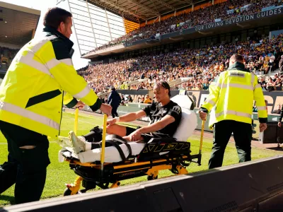 Tottenham Hotspur's Xavi Simons is stretchered off the pitch during the English Premier League soccer match between Wolverhampton Wanderers and Tottenham Hotspur in Wolverhampton, England, Saturday April 25, 2026. (Nick Potts/PA via AP)