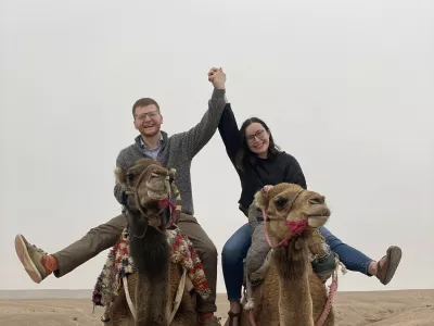 Story from Jam Press (House Sit Couple)Pictured: Ellen and her fianc&eacute;, Connor, in Morocco.'We cheat the hotel system by travelling the world while staying in strangers' luxury homes for FREE'A young couple cheat the hotel system by staying in strangers' luxury homes for free, helping them travel across the world together without blowing their budget.Ellen Carter, 26, and fianc&eacute; Connor Gill, 27, first tried house-sitting in early 2022 while they were still students and struggling to afford trips away.They have now stayed rent-free in 18 different countries, and plan to do two more before the year ends.Their first sit was hardly glamorous in distance, just ten minutes from Ellen's mum's home near Beaconsfield, Buckinghamshire.But the property itself was far from ordinary.The large Chilterns home near Gerrards Cross came with woodland, a cinema, a gym and three West Highland terriers to look after.At the time, Connor was completing the first year of his PhD while Ellen was finishing her Master's.The experience showed them they could slash one of the highest costs of travelling by swapping hotels for other people's homes.Just a few months later, in August 2022, they landed their first international pet-sit in Budapest, Hungary.Ellen had always wanted to visit the city but assumed they could only afford a rushed weekend.Instead, the couple spent ten days in a gated five-bedroom home with a huge garden and private swimming pool.The city centre was only a short bus journey away, while their location also offered quiet evenings, walking routes and little light pollution.Best of all, the accommodation cost them nothing."Budapest was probably the most luxurious house-sit we've done," Ellen told creatorzine.com."It had five bedrooms, a huge garden and a private swimming pool."We got really attached to the dog, Chilli, and we started getting into a rhythm of exploring somewhere new every day."It was probably the hardest one to leave."By cooking most of their meals at the house rather than eating out, Ellen says the entire ten-day trip &ndash; including flights and food &ndash; cost them just Ł200 each.It remains their cheapest holiday.The couple are also still in touch with the homeowners from both their Budapest and Gerrards Cross stays, turning what began as a money-saving arrangement into lasting connections.Since then, Ellen and Connor have travelled to 18 countries across three continents during their six-year relationship, mixing house-sits with more unusual travel experiences.One of their other standout stays was glamping in Morocco's Agafay Desert.Ellen said: "A close runner-up would be the glamping tent we stayed in in the Agafay Desert, Morocco."It was such a unique experience, with incredible stargazing and sunrises."Across their house-sits, the couple have clocked up more than 24 nights with no accommodation costs, including stays in Gerrards Cross, Budapest and Lymington.Ellen said the biggest advantage is the money saved, as well as being able to live more like locals.She said: "The biggest upside is the accommodation savings and access to a kitchen where we can cook for ourselves, rather than eating out at restaurants all the time."But the arrangement comes with responsibilities.Some pets require medication, while looking after somebody else's animal means they cannot simply disappear for entire days or stay out until the early hours.Ellen said: "It can be a lot of work if the pets require medication, which can be added responsibility and stress."Another downside is not being able to leave for huge periods of time."However, this suits our lifestyle as we don't drink or go out late very often, so this has never really bothered us."The pair use house-sitting platform HouseSit Match, which connects homeowners with travellers willing to care for their homes and pets in exchange for free accommodation.The couple are now living in Brazil for a year while Connor, a researcher, completes a work contract.Ellen, who previously worked as a caseworker for a Member of Parliament, has taken a career break.They are hoping Uruguay will become country number 19 in November, followed by Chile in December, where they plan to explore Patagonia before continuing to Santiago, Peru and the Amazon rainforest.ENDSEDITOR'S NOTE: Exclusive Licence: An exclusive licence has been obtained directly from the verified copyright holder. Jam Press holds exclusive distribution rights for the agreed content within the terms of the contributor agreement.,Image: 1141378330, License: Rights-managed, Restrictions: EDITOR'S NOTE: Exclusive Licence: An exclusive licence has been obtained directly from the verified copyright holder. Jam Press holds exclusive distribution rights for the agreed content within the terms of the contributor agreement., Model Release: no 