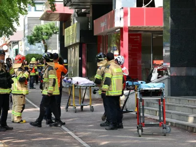 Firefighters and policemen gather outside the scene where several people were injured in a stabbing incident, in Incheon, South Korea, October 13, 2026.  Yonhap via REUTERS  THIS IMAGE HAS BEEN SUPPLIED BY A THIRD PARTY. NO RESALES. NO ARCHIVES. SOUTH KOREA OUT. NO COMMERCIAL OR EDITORIAL SALES IN SOUTH KOREA.