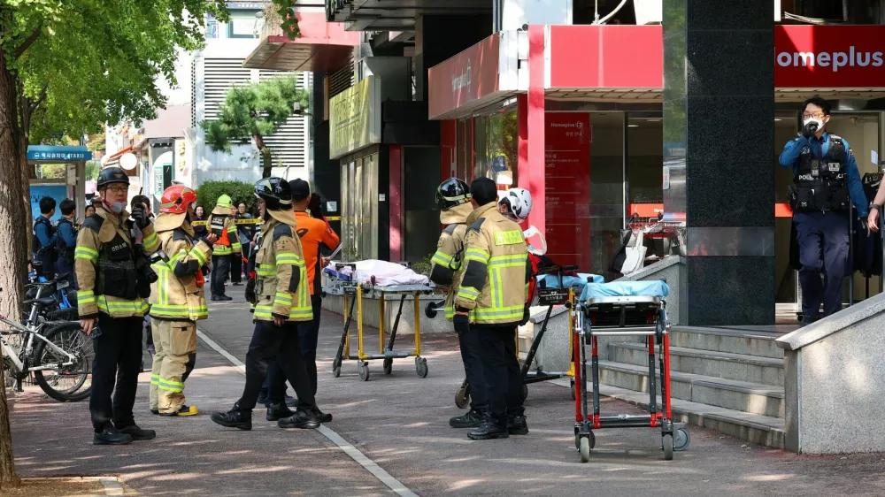 Firefighters and policemen gather outside the scene where several people were injured in a stabbing incident, in Incheon, South Korea, October 13, 2026.  Yonhap via REUTERS  THIS IMAGE HAS BEEN SUPPLIED BY A THIRD PARTY. NO RESALES. NO ARCHIVES. SOUTH KOREA OUT. NO COMMERCIAL OR EDITORIAL SALES IN SOUTH KOREA.