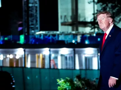 President Donald Trump walks past ballroom construction after arriving in Marine One on the South Lawn of the White House, Monday, Oct. 12, 2026, in Washington. (AP Photo/Julia Demaree Nikhinson)