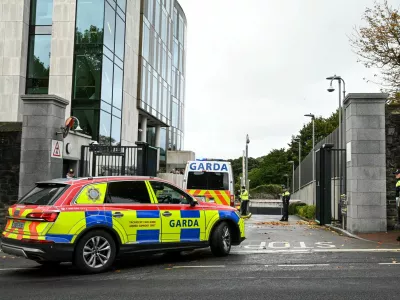Garda vehicles arrive at the Special Criminal Court, where alleged Irish crime gang boss Daniel Kinahan is due to appear on charges of directing a criminal organisation, in Dublin, Ireland, October 12, 2026. REUTERS/Natalia Campos