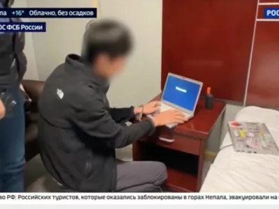A view of the arrest of a person, identified by Russia's Federal Security Service (FSB) as a Japanese journalist for the Hokkaido Shimbun newspaper and accused of gathering information on Russia's defence capabilities, at an unidentified location, in this still image taken from a video aired by Rossiya-24 (RU24) state TV channel and released October 13, 2026. Rossiya-24/Handout via REUTERS ATTENTION EDITORS - THIS IMAGE HAS BEEN SUPPLIED BY A THIRD PARTY. NO RESALES. NO ARCHIVES. MANDATORY CREDIT. BLURRING AND OVERLAYS FROM SOURCE.