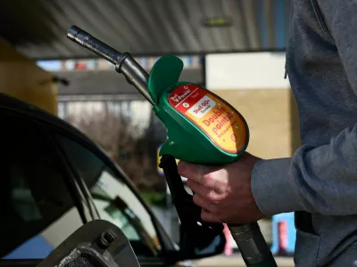 FILE PHOTO: A motorist returns the petrol pump after filling their car with fuel at a petrol station, as the price of oil and gas has surged amid the conflict in the Middle East, in London, Britain, March 5, 2026 REUTERS/Jack Taylor/File Photo