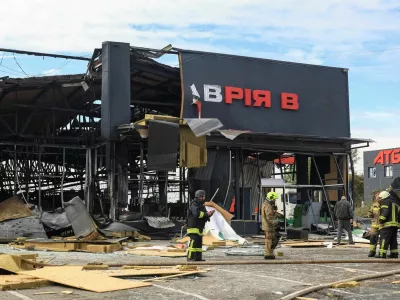 Firefighters work at a site of the supermarket damaged by a Russian jet drone strike, amid Russia's attack on Ukraine, in Odesa region, Ukraine October 15, 2026. REUTERS/Nina Liashonok
