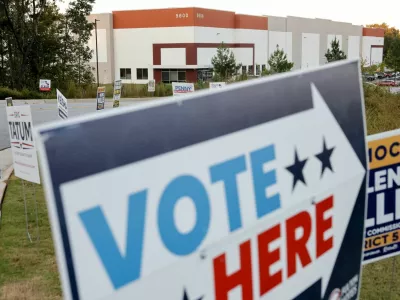 Early midterm voting is advertised at a polling place in the Fulton County Election Hub and Operation Center, the site searched by the FBI and then-Director of National Intelligence Tulsi Gabbard in January, in Union City, Georgia, US, October 13, 2026. REUTERS/Jonathan Ernst 