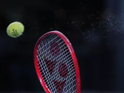 Tommy Paul, of the United States, serves to Zizou Bergs, of Belgium, during the fourth round of the men's singles match at the Shanghai Masters tennis tournament in Shanghai, China, Wednesday, Oct. 14, 2026. (AP Photo/Andy Wong)