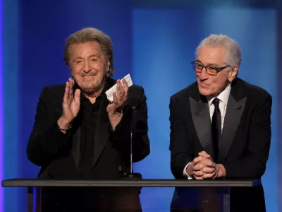 FILE PHOTO: Al Pacino and Robert De Niro react onstage during the 50th AFI Life Achievement Award at Dolby Theatre in Los Angeles, California, U.S., April 26, 2025. REUTERS/Mario Anzuoni/File Photo