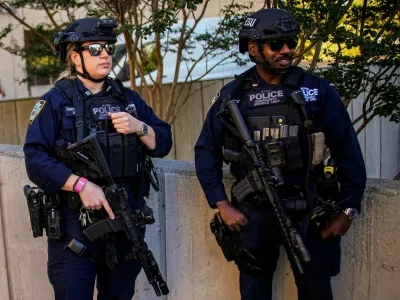 New York City Police Department (NYPD) Emergency Service Unit officers stand guard near the Daniel Patrick Moynihan United States Courthouse before the departure of a motorcade carrying Venezuelan President Nicolas Maduro and his wife, Cilia Flores, after they faced a new indictment accusing them of torturing political opponents and U.S. citizens to retain their grip on power, in New York City, US, October 15, 2026. REUTERS/Eduardo Munoz