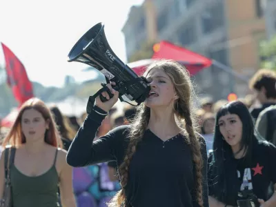 A demonstrator shouts slogans through a megaphone during a student protest against the Italian government's education policies in Rome, Italy, October 16, 2026. REUTERS/Francesco Fotia