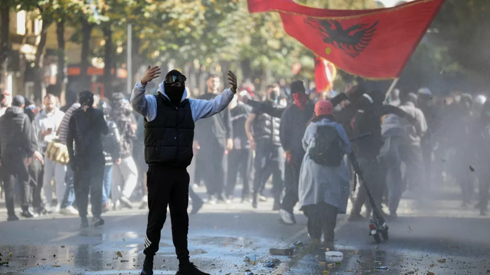 A demonstrator gestures toward police postions near the Ministry of Education during an anti-government protest by students in Tirana, Albania, October 16, 2026. REUTERS/Louisa Gouliamaki