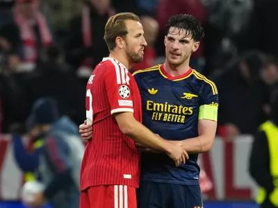 Bayern's Harry Kane, left, and Arsenal's Declan Rice talk after the UEFA Champions League soccer match between Bayern and Arsenal in Munich Germany, Wednesday, Oct. 21, 2026. (AP Photo/Martin Meissner)