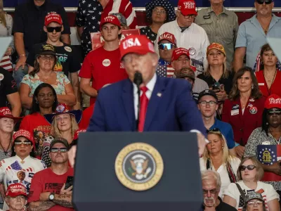 Attendees listen as US President Donald Trump speaks at a campaign event in Dalton, Georgia, US, October 16, 2026. REUTERS/Elijah Nouvelage