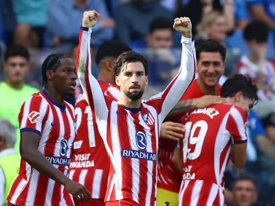 Soccer Football - LaLiga - Espanyol v Atletico Madrid - RCDE Stadium, Cornella de Llobregat, Spain - October 17, 2026 Atletico Madrid's Alex Baena celebrates scoring their first goal with Jonathan David REUTERS/Albert Gea