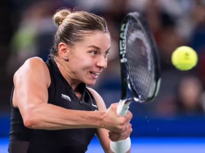 Maja Chwalinska of Poland returns the ball against her compatriot Iga Swiatek in a women's singles semifinal match during the 2026 Wuhan Open tennis tournament in Wuhan in central China's Hubei Province on Saturday, Oct. 17, 2026. (Chinatopix Via AP) 