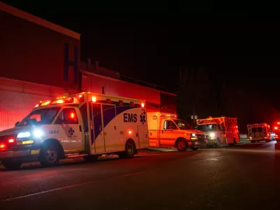 Emergency crews and military personnel gather at the Wainwright Health Centre as injured military members are treated after a fire at Canadian Forces Base Wainwright, outside of Wainwright, Alberta Saturday, Oct. 17, 2026. (John Ulan/The Canadian Press via AP)