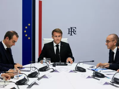 France's President Emmanuel Macron, center, hosts an Interministerial Crisis Meeting at the Elysee Presidential Palace, in Paris, on Sunday, Oct. 18, 2026 the day after nationwide riots. (Ludovic Marin/Pool Photo via AP)