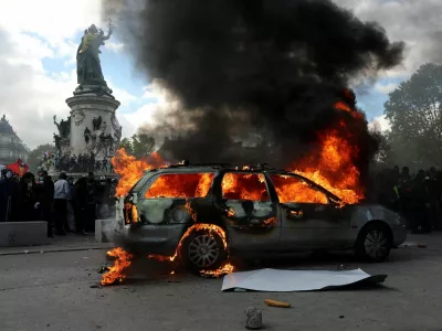 A car burns amid clashes between protesters and the French police during a demonstration against the cost of living and rising fuel prices at the Place de la Republique in Paris as part of nationwide protests called by the "Yellow Vests" movement, joined by French high school and university students, teachers and parents demanding better school conditions and government action, as well as labour unions, workers, farmers and retirees, France, October 17, 2026. REUTERS/Stephanie Lecocq&nbsp;   TPX IMAGES OF THE DAY