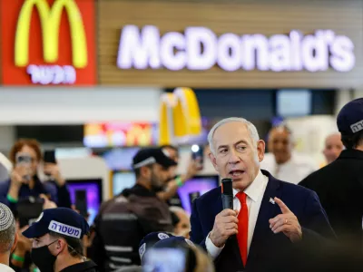Israeli Prime Minister Benjamin Netanyahu speaks near a McDonald's as he meets members of the public at a mall, ahead of Israel's national election, in Ramla, Israel October 19, 2026. REUTERS/Amir Cohen