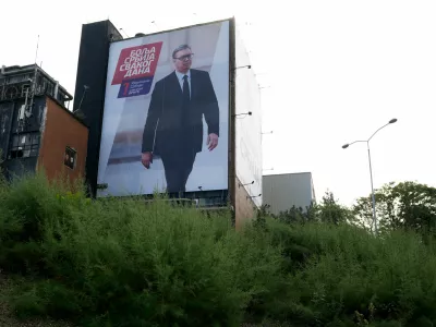 A billboard with an image of Aleksandar Vucic, former authoritarian president, is seen on a closed brewery in Belgrade, Serbia, Sunday, Oct. 18, 2026. (AP Photo/Darko Vojinovic)