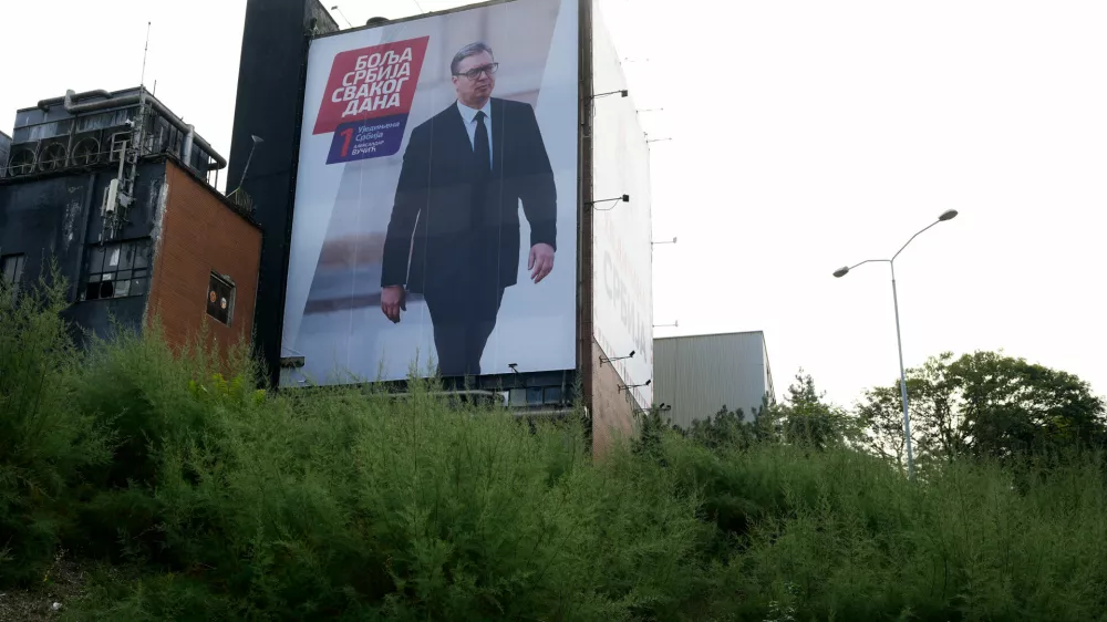 A billboard with an image of Aleksandar Vucic, former authoritarian president, is seen on a closed brewery in Belgrade, Serbia, Sunday, Oct. 18, 2026. (AP Photo/Darko Vojinovic)
